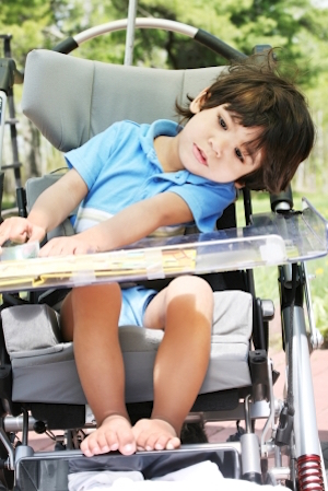 little boy in wheelchair